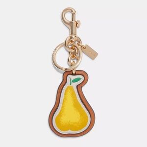 Coach Pear Bag Charm In Signature Canvas Style C8249